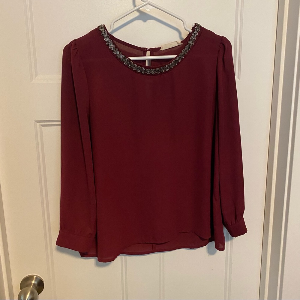 Maroon top with neck detail size L